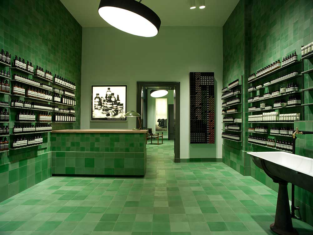 Aesop Berlin Mitte store with green-tiled interior