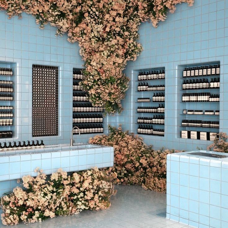 Aesop blue-tile store interior with cherry blossom installation