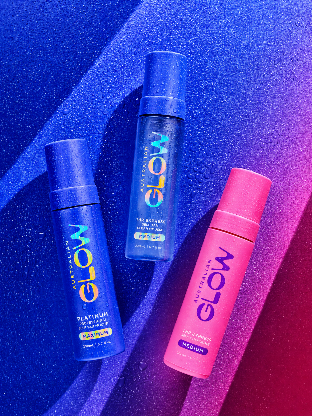 Australian Glow Platinum Professional Self Tan Mousse — three bottles on cobalt-magenta gradient