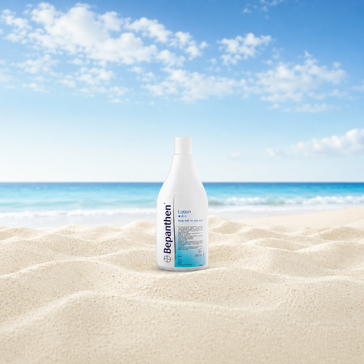 Bepanthen lotion bottle on Australian sand &mdash; the beach-bag staple