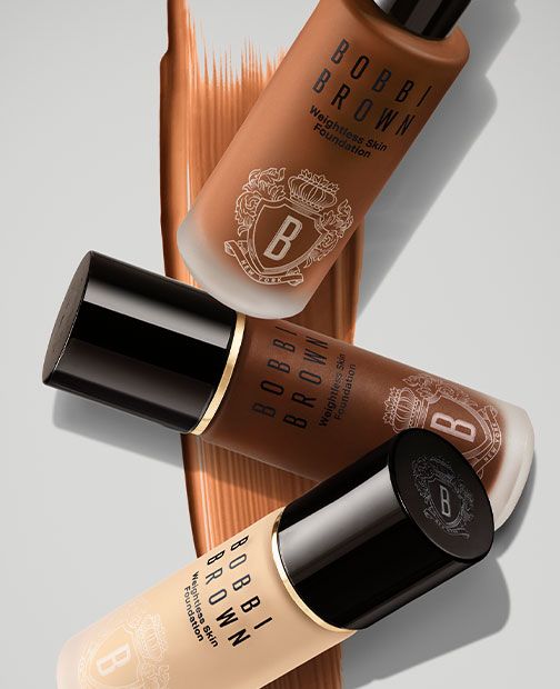 Bobbi Brown Weightless Skin Foundation trio on bronze flatlay