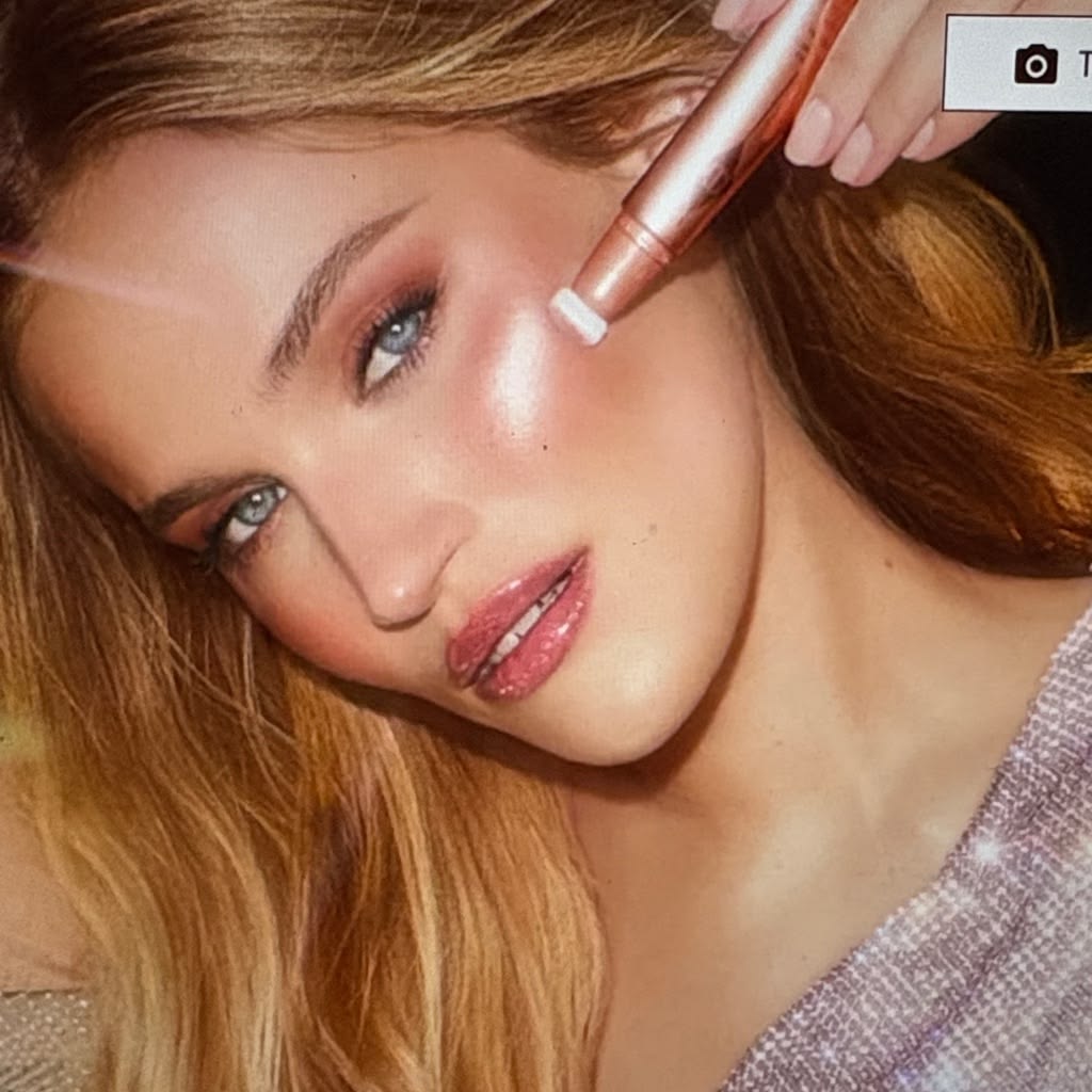Charlotte Tilbury Beauty Light Wand on red-haired model — close portrait