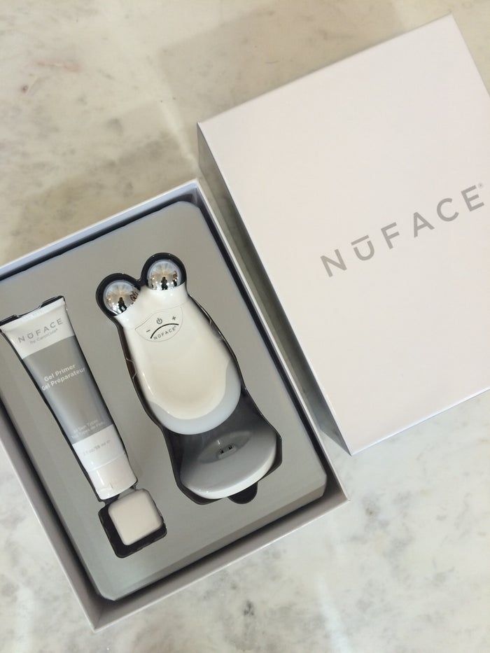 NuFACE Hydrating Aqua Gel and Trinity device on marble — the required consumable