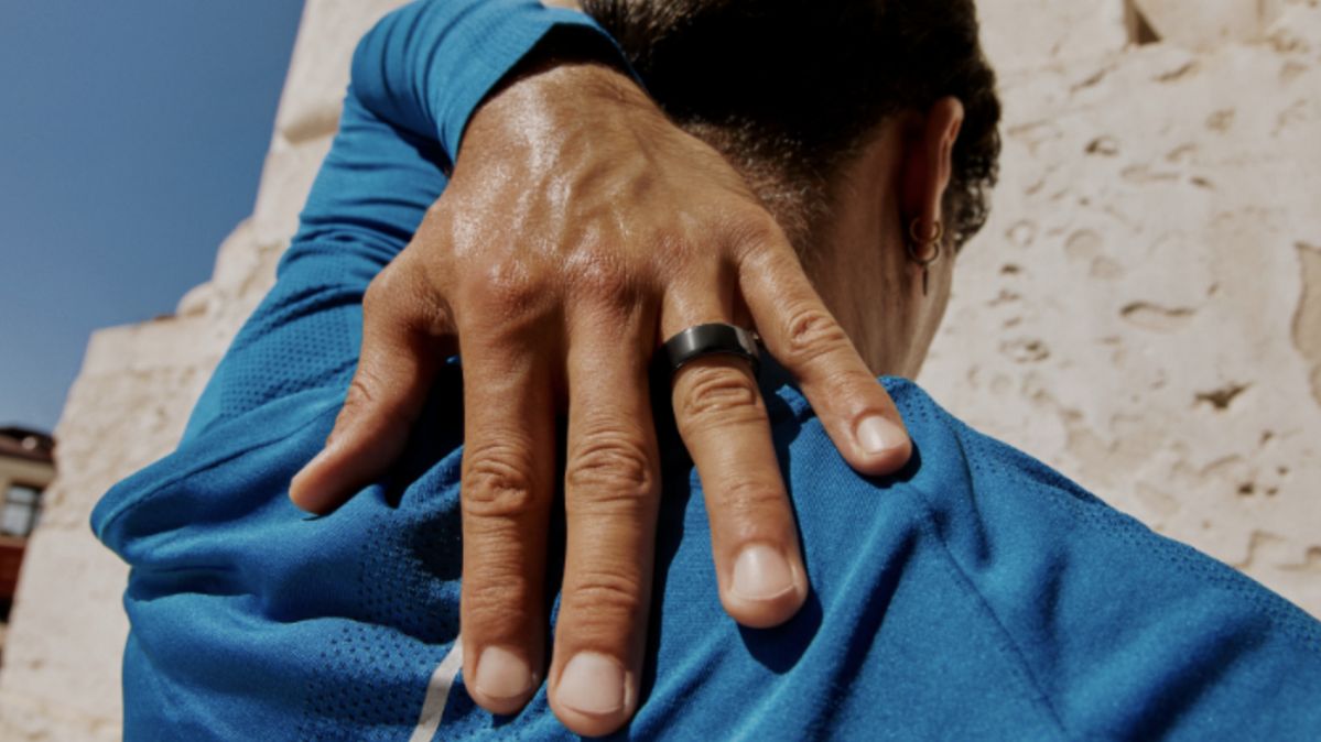 Oura Ring portrait — model wearing the ring in natural light