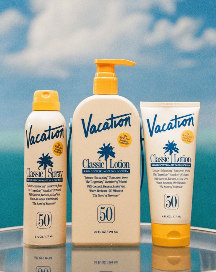 Vacation Classic Spray, Lotion and Cream trio against sky