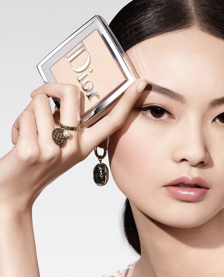 Dior Backstage compact and model — luxury beauty editorial