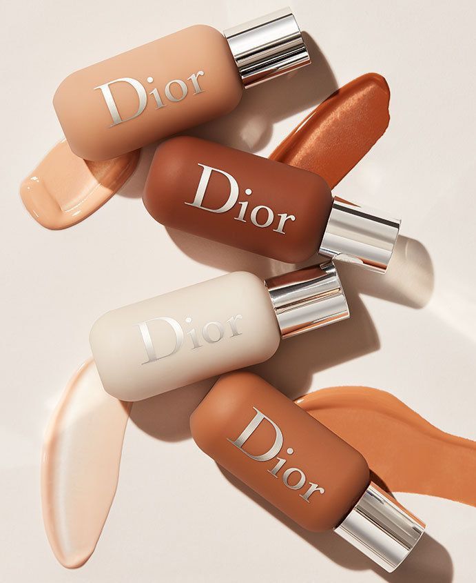 Dior Backstage Face & Body Foundation laid flat with swatches in four shades
