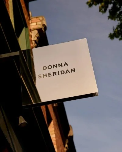Donna Sheridan facade gold lettering