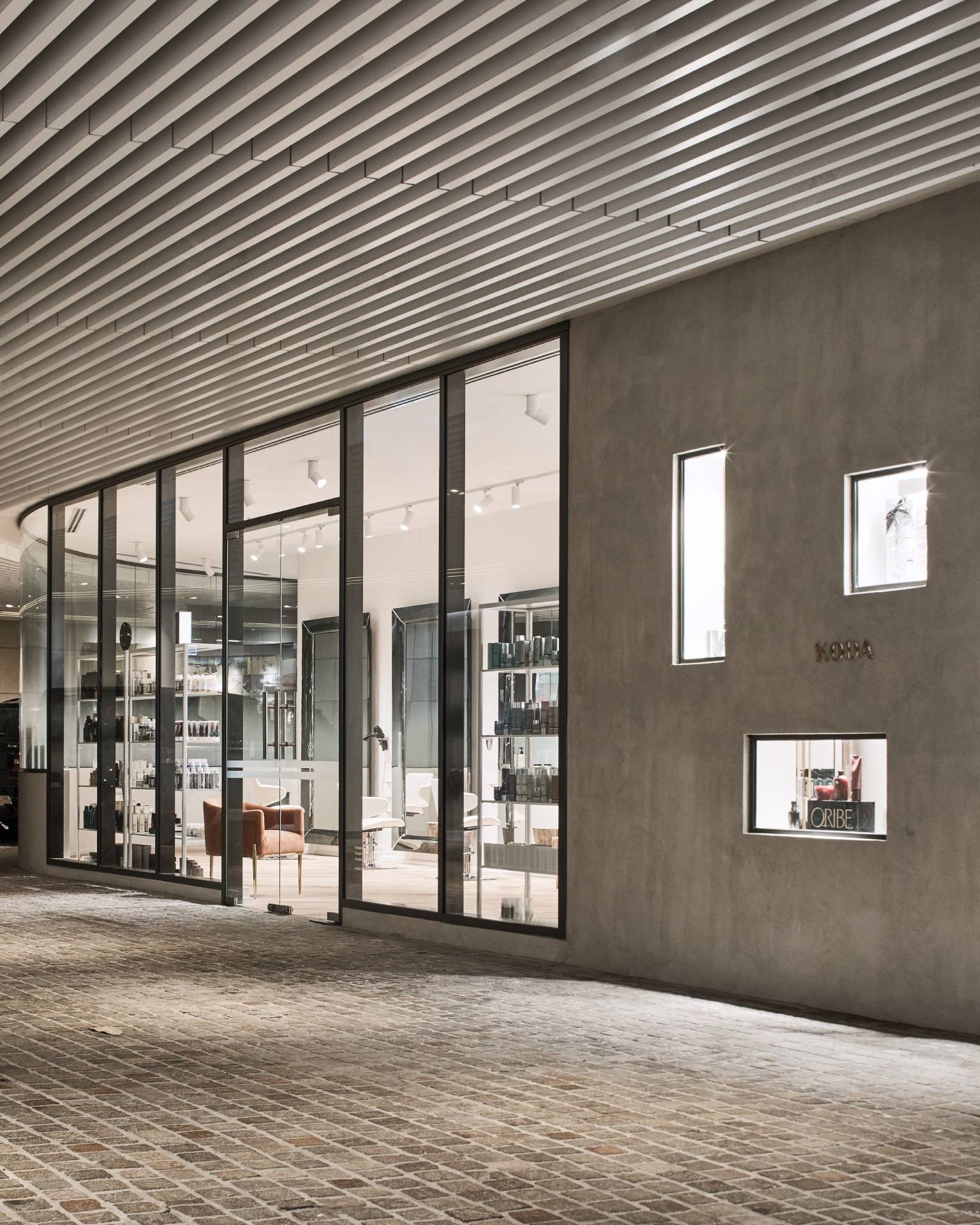 Koda Cutters — salon architecture and concrete facade
