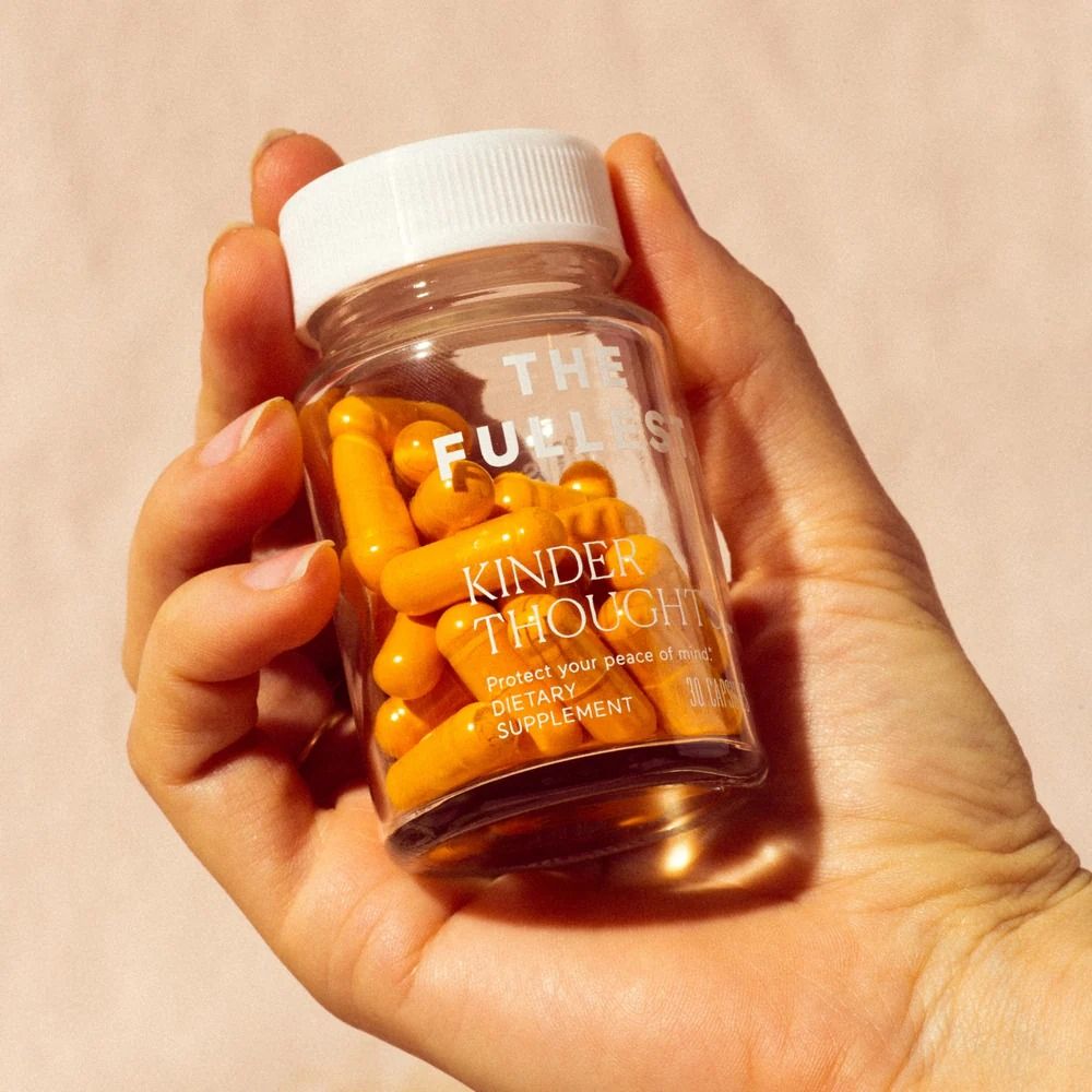 Supplements editorial — capsules in palm