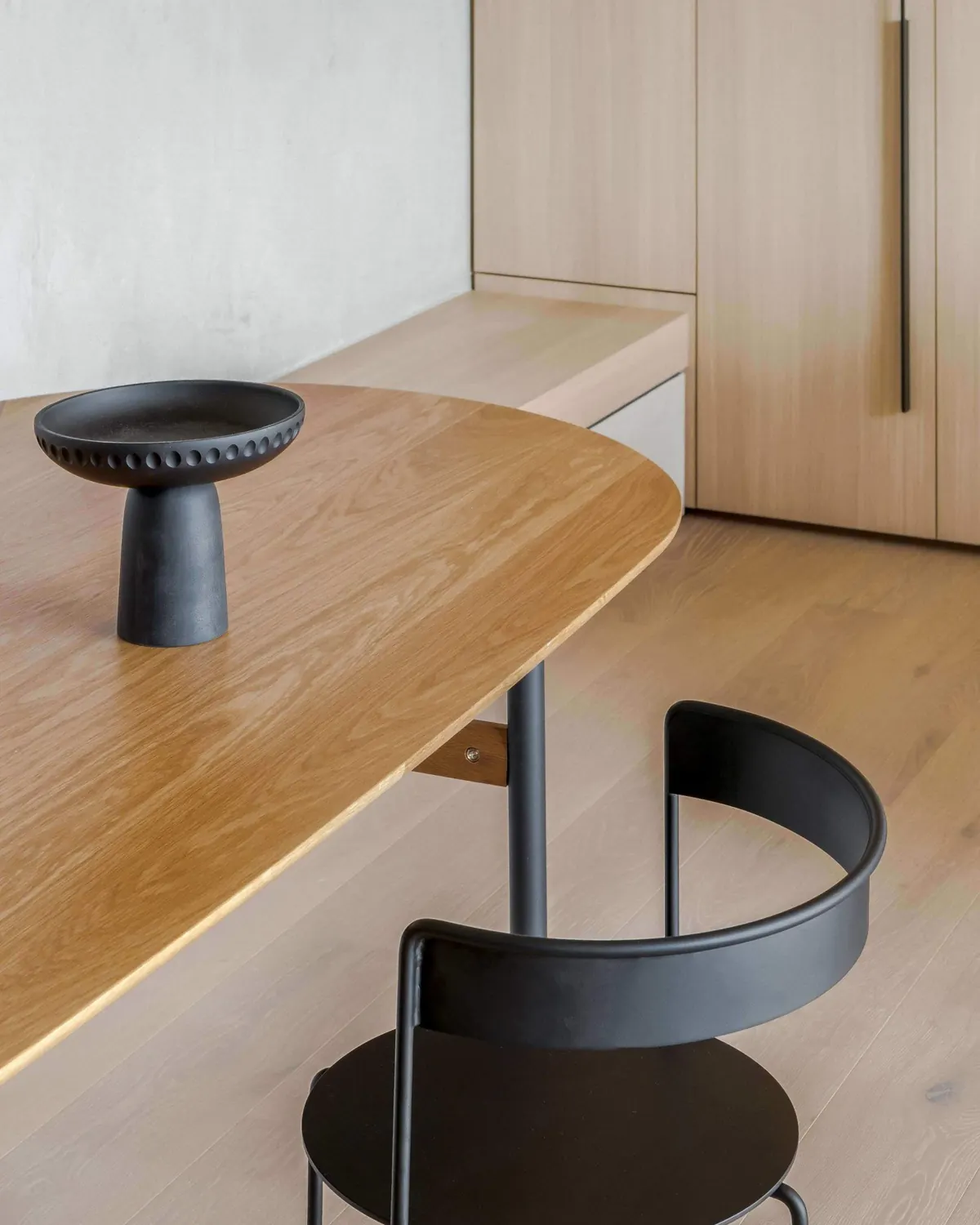 Oak bench and a black chair