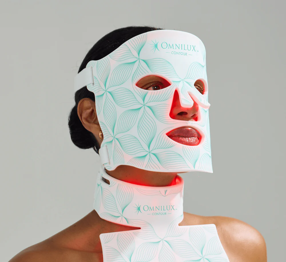 Model wearing the Omnilux Contour Face flexible-silicone LED mask