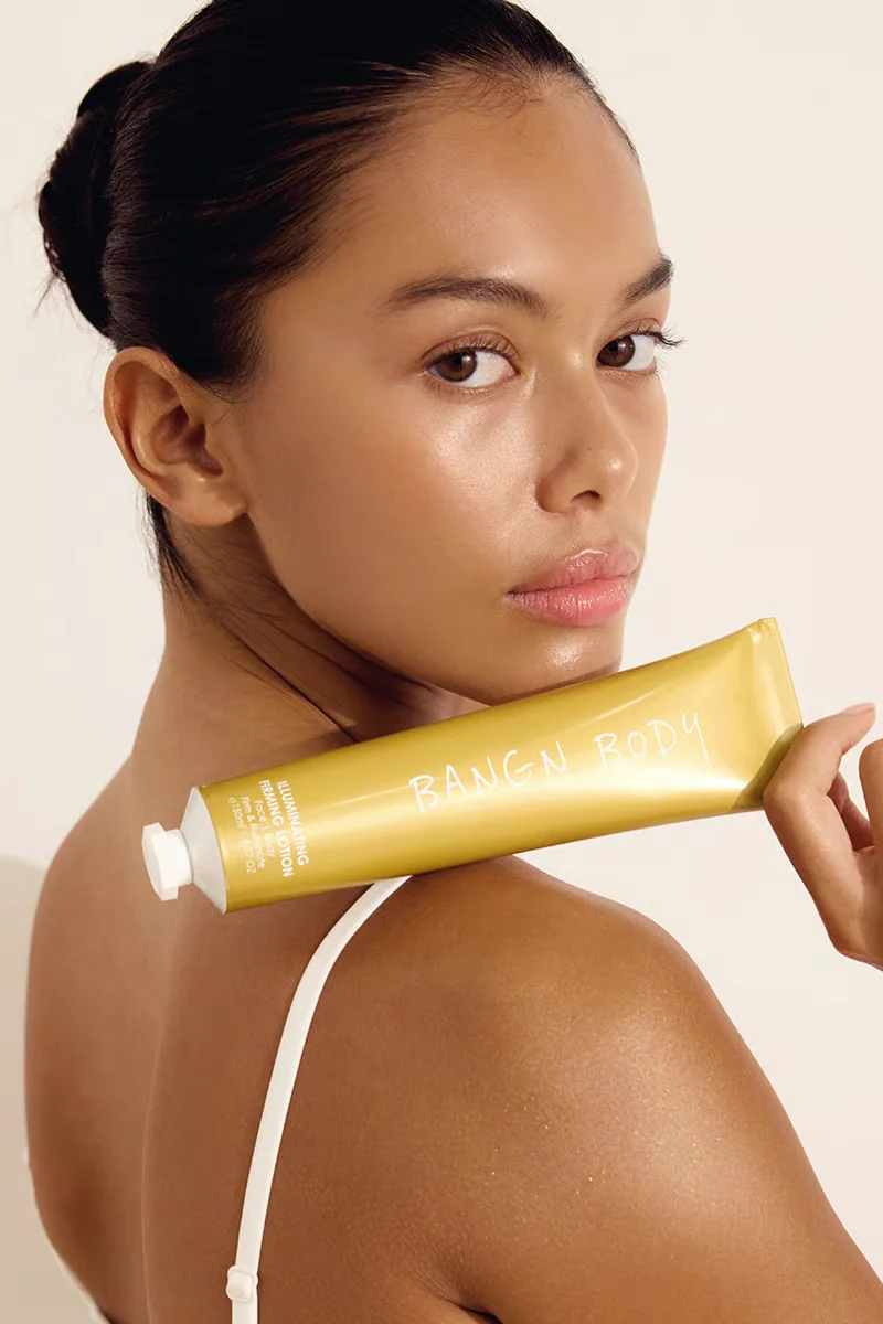 Model wearing Bangn Body Firming Lotion — pretty, but a moisturiser
